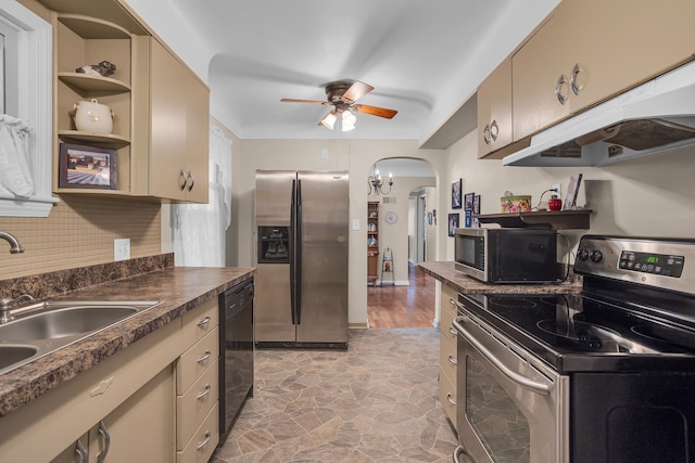 kitchen with ceiling fan, sink, light hardwood / wood-style floors, decorative backsplash, and appliances with stainless steel finishes