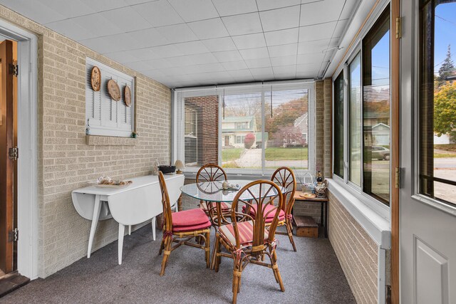 sunroom / solarium featuring plenty of natural light