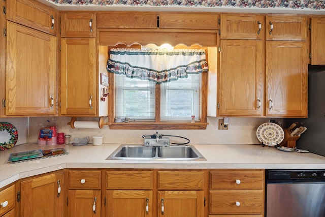 kitchen with tasteful backsplash, sink, and stainless steel dishwasher