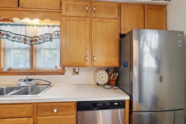 kitchen with sink and appliances with stainless steel finishes