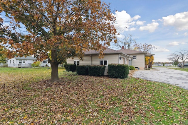 view of property exterior featuring a yard