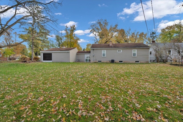 rear view of house with a lawn