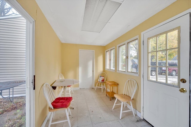 sunroom / solarium featuring a healthy amount of sunlight