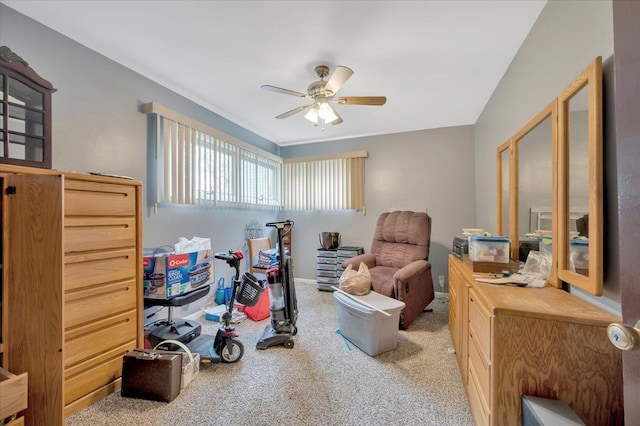 interior space with ceiling fan and light carpet