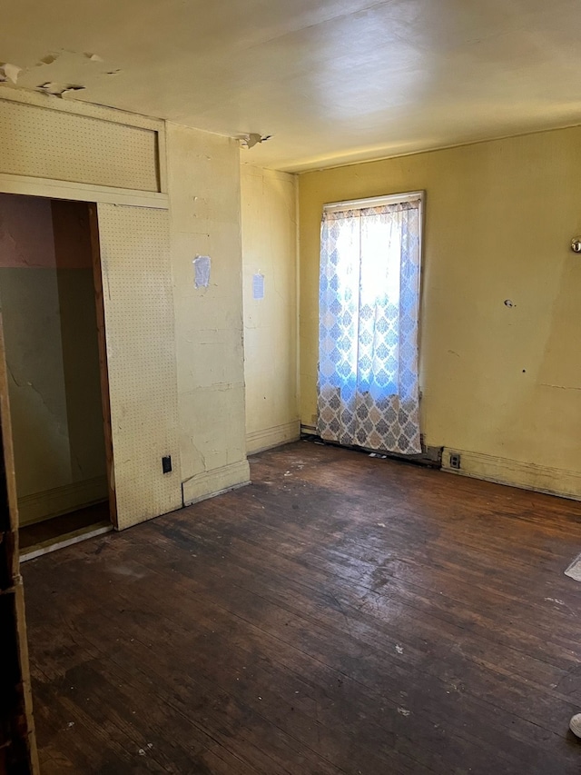 empty room with hardwood / wood-style floors