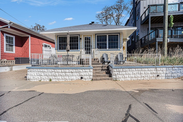 view of front of house featuring cooling unit