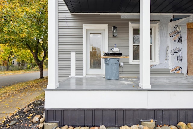 view of exterior entry with covered porch