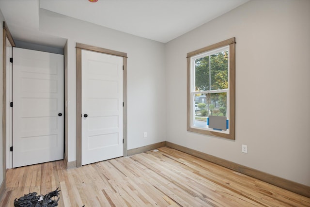 unfurnished bedroom featuring light hardwood / wood-style floors