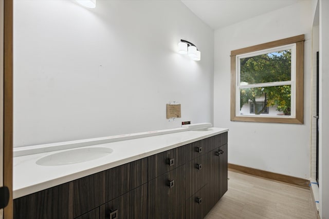 bathroom featuring hardwood / wood-style floors and vanity