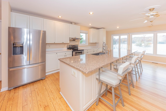 kitchen with sink, white cabinetry, and stainless steel appliances