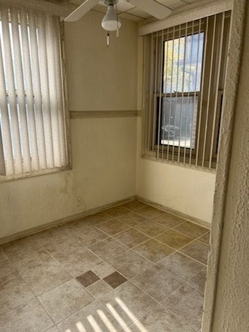 empty room featuring ceiling fan