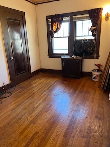 unfurnished bedroom with wood-type flooring