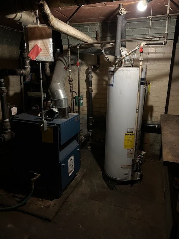 utility room with gas water heater