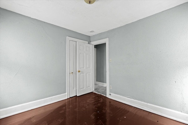 16644 Washburn St, Detroit, MI 48221 - unfurnished bedroom with wood finished floors and baseboards