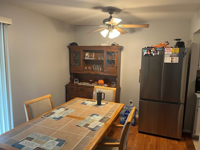 dining room featuring hardwood / wood-style floors and ceiling fan