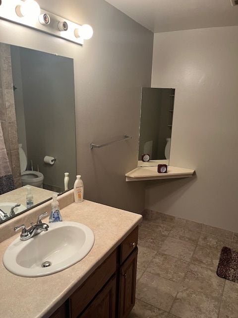 bathroom with vanity and toilet