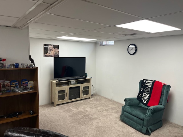 interior space featuring carpet and a drop ceiling