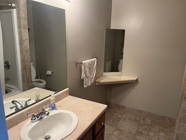 full bathroom with shower / bathing tub combination, vanity, and toilet