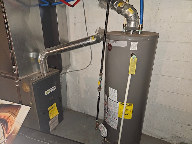 utility room featuring heating unit and water heater