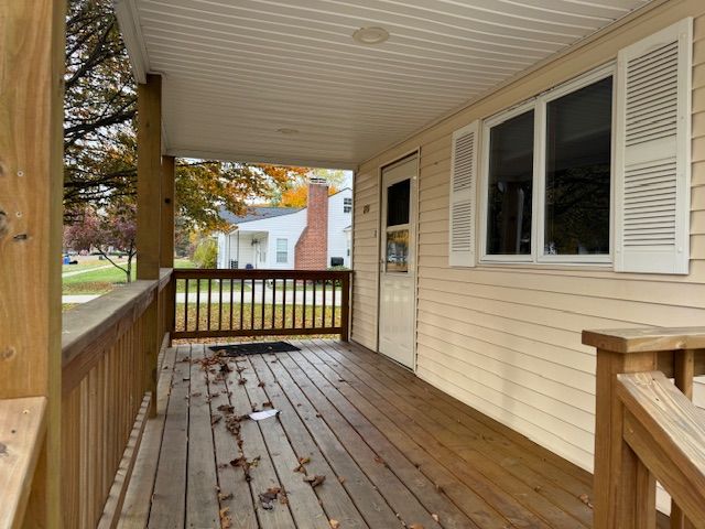 wooden terrace with a porch