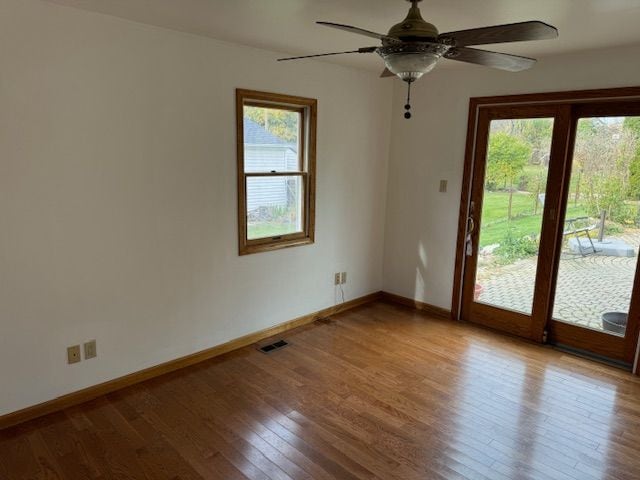 empty room featuring ceiling fan and light hardwood / wood-style floors