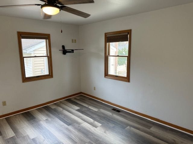 unfurnished room with wood-type flooring and ceiling fan