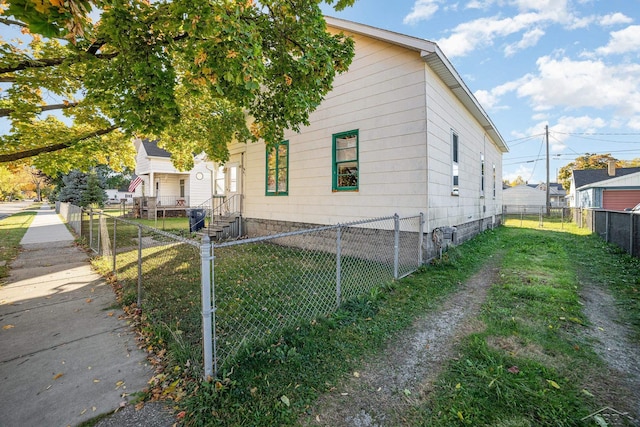 view of home's exterior with a yard