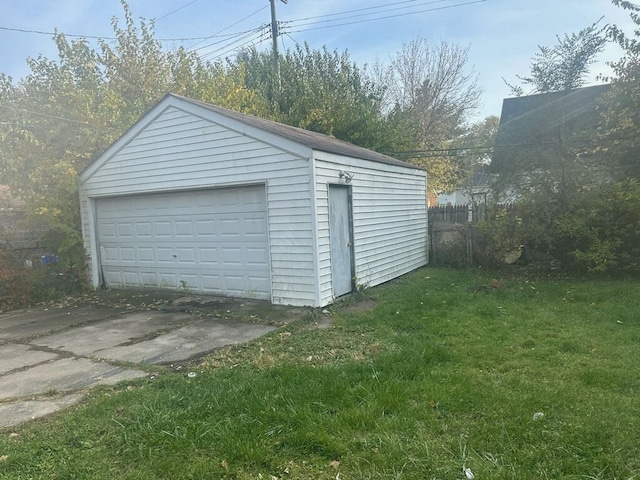 garage with a yard