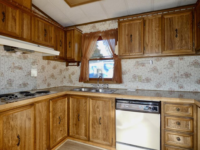 3924 W Jefferson Ave Unit 3924, Trenton, MI 48183 - kitchen featuring dishwasher, wallpapered walls, under cabinet range hood, a sink, and electric cooktop