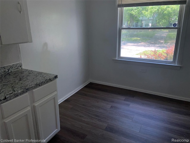 18498 Fielding St, Detroit, MI 48219 - unfurnished dining area featuring dark wood finished floors and baseboards