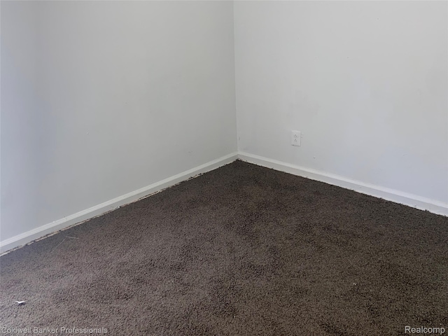 18498 Fielding St, Detroit, MI 48219 - spare room featuring dark colored carpet and baseboards