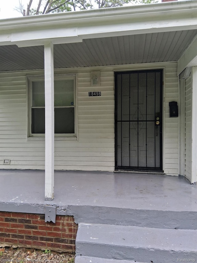 18498 Fielding St, Detroit, MI 48219 - doorway to property featuring covered porch