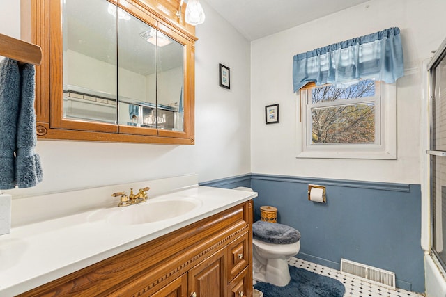 bathroom with vanity and toilet