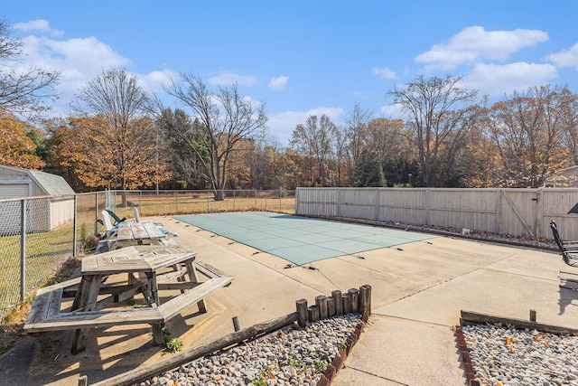 view of swimming pool featuring a patio area