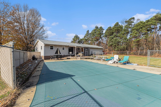 view of swimming pool featuring a patio