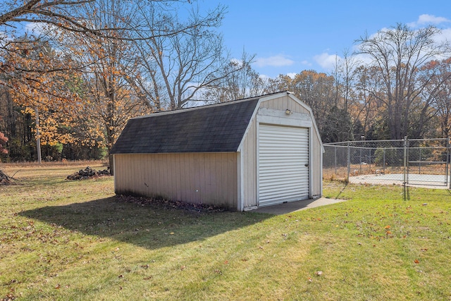 view of outdoor structure featuring a lawn