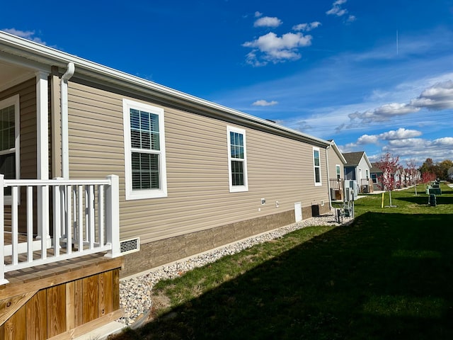 view of property exterior featuring a lawn