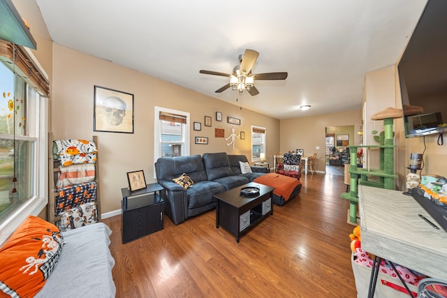 living room with hardwood / wood-style flooring and ceiling fan