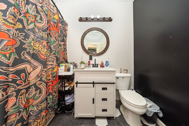 bathroom featuring tile patterned flooring, vanity, and toilet