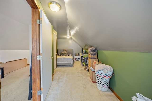 carpeted bedroom with vaulted ceiling