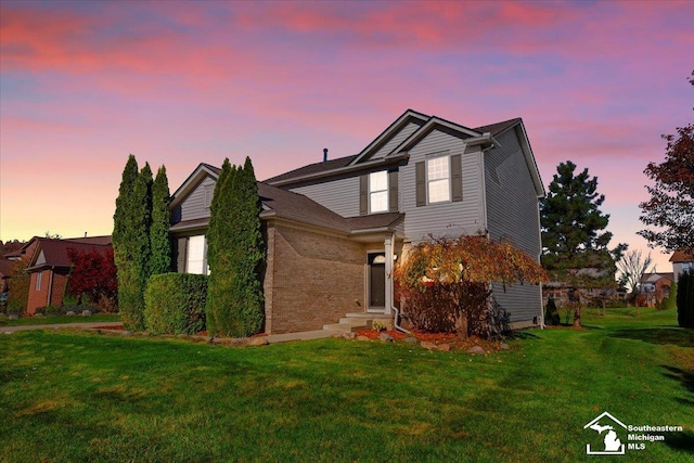 view of property featuring a yard