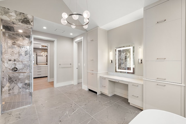 bathroom with vanity, an enclosed shower, and a notable chandelier