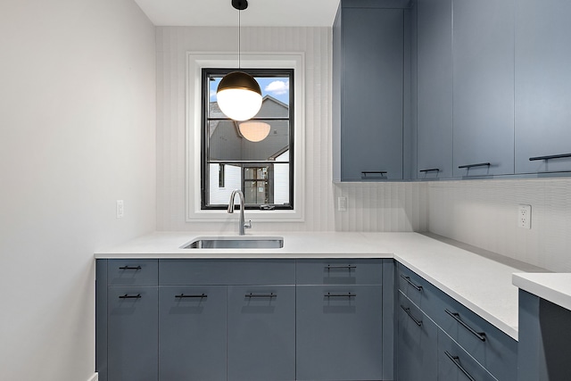 kitchen with decorative light fixtures and sink