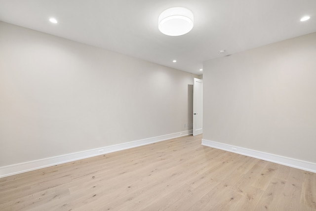 empty room with light hardwood / wood-style flooring