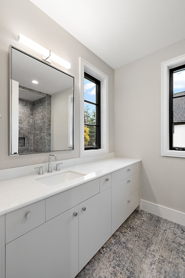 bathroom featuring vanity and a healthy amount of sunlight