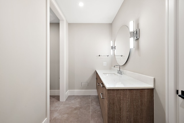 bathroom with tile patterned floors and vanity