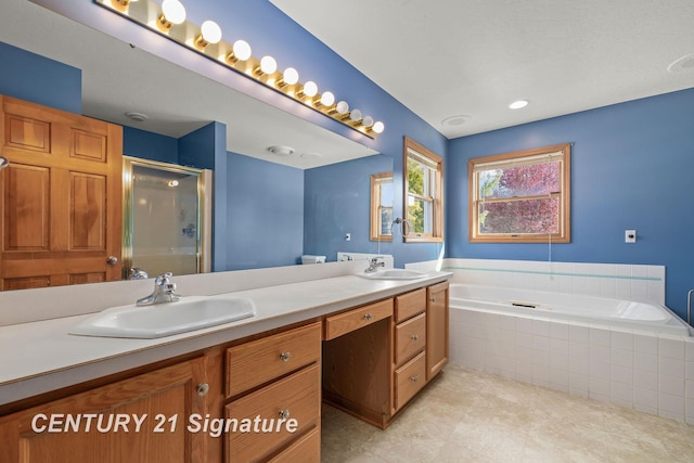 bathroom with tile patterned floors, vanity, and independent shower and bath