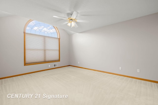 empty room featuring ceiling fan and carpet floors