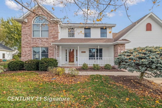 front facade with a front lawn