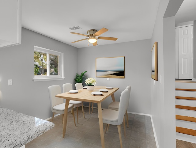 dining room featuring ceiling fan